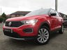 USED 2019 69 VOLKSWAGEN T-ROC 1.5 SE TSI EVO DSG 5d 148 BHP Finished in FLASH RED with contrasting Sports Trim. This T-Roc is for those who want a compact SUV with smart styling and a good level of practicality. This Golf based SUV is both practical and fun to drive. Features include, Sat Nav, Apple Play, 17" Alloys, Heated Seats, DAB Radio, Power rear boot, Cruise Control, B/Tooth and much more. VW Dealer serviced at 20006 miles, 38263 miles and at 57801 miles.