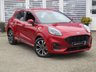 USED 2020 70 FORD PUMA 1.0 ST-LINE 5d 123 BHP Finished in LUCID RED METALLIC with Grey Trim. This Ford Puma certainly looks the part. It&rsquo;s got the raised up driving position, the eye-catching design, and a sort of miniature SUV shape. Features include Sat Nav, DAB Radio, B/Tooth, Apple Play, Virtual Dash and great Low Mileage. Dealer serviced at 8735 miles.