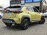 USED 2022 22 TOYOTA YARIS CROSS 1.5 DYNAMIC 5d 115 BHP Finished in BRASS GOLD MET, BLACK ROOF with Part Leather Heated Trim. This is a handsome compact SUV with an extremely economical hybrid powertrain. If the regular Yaris small car isn&rsquo;t quite butch enough for you, then cast your eyes over this Yaris Cross. Features include, Sat Nav, Heated Seats, Rear View Camera, 18" Alloys, DAB Radio, B/Tooth, Power Folding Mirrors and more. Dealer serviced at 8130 miles and then on arrival at 16596 miles.