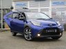 USED 2022 22 TOYOTA AYGO X 1.0 VVT-I EDGE 5d 71 BHP Finished in JUNIPER BLUE WITH BLACK and Dark Grey Sports Trim. The Toyota Aygo X is a raised ride height supermini that packs a surprisingly spacious interior and is great to drive. This affordable and economic Aygo X has some great spec which includes, 18" Alloys, Apple Play, Rear view Camera, Cruise Control DAB Radio, B/Tooth and much more. Dealer serviced at 6855 miles and is still under Toyota Warranty.