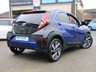 USED 2022 22 TOYOTA AYGO X 1.0 VVT-I EDGE 5d 71 BHP Finished in JUNIPER BLUE WITH BLACK and Dark Grey Sports Trim. The Toyota Aygo X is a raised ride height supermini that packs a surprisingly spacious interior and is great to drive. This affordable and economic Aygo X has some great spec which includes, 18" Alloys, Apple Play, Rear view Camera, Cruise Control DAB Radio, B/Tooth and much more. Dealer serviced at 6855 miles and is still under Toyota Warranty.