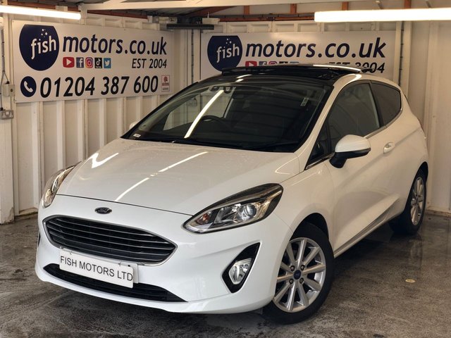 2017 67 FORD FIESTA 1.0 TITANIUM 3d 99 BHP+PANORAMIC SUNROOF+SATNAV+2KEYS+ 2 KEYS+PANORAMIC ROOF+1 OWNER FROM NEW+AIRCON+PARKING SENSORS+HISTORY+NAV+ALLOYS+FROZEN WHITE PAINT+CLOTH TRIM+USB+MEDIA+AUX+HPI CLEAR+VOSA MOT HISTORY,+FULL DEALER FACILITIES+GOOD MPG,+RAC CHECKED+ The car is in very good condition in and out . Bodywork has no obvious dents or scratches . Interior is very clean without any obvious wear or tear to the seats or carpets.Tyres excellent ,Engine+gearbox in good order.