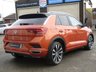 USED 2019 69 VOLKSWAGEN T-ROC 1.5 R-LINE TSI EVO DSG 5d 148 BHP Finished in ENERGETIC ORANGE MET with BLACK ROOF and contrasting Sports Trim. This T-Roc is for those who want a compact SUV with smart styling and a good level of practicality. This Golf based SUV is both practical and fun to drive. Features include, Pan Roof, Sat Nav, VIRTUAL DASH, Apple Play, 19" Alloys, DAB Radio, Part Leather Trim, Rear Electric Boot and Rear Camera and much more. Just Dealer serviced at 88836 miles on 13/4/2024.