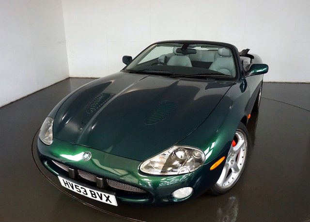 2003 53 Jaguar Xkr 4.2 XKR CONVERTIBLE 2d AUTO 400 BHP-Supplied New By H A Fox Southampton-Less than 24,000 miles documented from new-Two registered Owners- Finished in Racing Green with Dove leather upholstery-BBS split-rim alloys-Cross-drilled brake discs-A thick history file-virtually all by main Jaguar dealers-Original sales invoice showing &pound;64,726.97 purchase price-Dark Birdseye Maple veneers in good order with light grey finish-Black fabric roof in good order with Dove tonneau and clear rear glass screen-Wood and leather steering wheel-Parking sensors-4,196cc AJ8 V8 Jaguar engine-A One Off Example