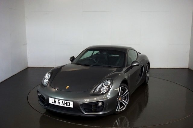 2015 15 Porsche Cayman 2.7 981 PDK 2d AUTO 275 BHP-Factory extras worth &pound;3,335-AGATE GREY METALLIC-SUPERB EXAMPLE HAVING ONLY COVERED 32000 MILES-SATNAV-CLIMATE CONTROL-HEATED SEATS-19 INCH ALLOY WHEELS-HALF BLACK LEATHER SEATS WITH ALCANTARA INSERTS-PARKING SENSORS-SOUND PACKAGE PLUS-PARK ASSIST FRONT & REAR-SPORT DESIGN STEERING WHEEL-FANTASTIC LOOKING CAYMAN 