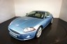 USED 2006 56 JAGUAR XK 4.2 COUPE 2d AUTO 294 BHP-2 FORMER KEEPERS-FINISHED IN FROST BLUE METALLIC-HEATED IVORY LEATHER UPHOLSTERY-SUPERB LOW MILEAGE-CRUISE CONTROL-LEATHER STEERING WHEEL-FRONT & REAR PARKING SENSORS-20
