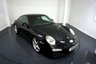 USED 2010 10 PORSCHE 911 3.6 997 Carrera Coupe 2dr Petrol PDK (230 g/km, 345 bhp)-Factory extras worth &pound;5,366-Superb Low Mileage Example-Finished in Basalt Black with Heated Black Leather Upholstery-Climate Control-Cruise Control-Mfsw-Bluetooth-Satnav-3 Former Keepers-19 Inch Carrera Classic Alloy Wheels-Rear Park Assist-Porsche Active Suspension Management =PASM.Great Value and Specification. 