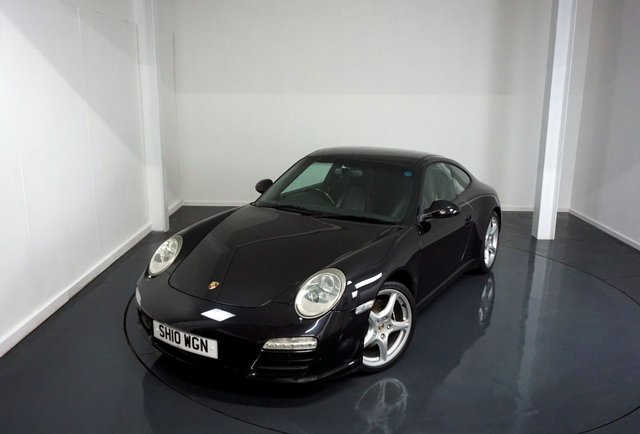 2010 10 Porsche 911 3.6 997 Carrera Coupe 2dr Petrol PDK (230 g/km, 345 bhp)-Factory extras worth &pound;5,366-Superb Low Mileage Example-Finished in Basalt Black with Heated Black Leather Upholstery-Climate Control-Cruise Control-Mfsw-Bluetooth-Satnav-3 Former Keepers-19 Inch Carrera Classic Alloy Wheels-Rear Park Assist-Porsche Active Suspension Management =PASM.Great Value and Specification.