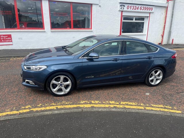 2019 FORD MONDEO 2.0 TiVCT Titanium Edition Saloon 4dr Petrol Hybrid CVT 6Spd Euro 6 (s/s) (187 ps) NOW FOR SOMETHING A LITTLE DIFFERENT+FINISHED IN LOVELY METALLIC BLUE PAINT+PETROL HYBRID+ONLY 1 PREVIOUS OWNER+FULL LEATHER INTERIOR+SATELLITE NAVIGATION+PARK ASSIST+CLIMATE CONTROL+ALLOY WHEELS+COST NEW &pound;26695 MAKING THIS USED VEHICLE OUTSTANDING VALUE AT OUR LOW PRICE+1 FULL YEARS MOT PRIOR TO COLLECTION+CALL NOW TO SPEAK WITH OUR EXPERIENCED SALES TEAM AND ARRANGE A VIEWING+DONT MISS OUT, THIS WONT HANG AROUND FOR LONG!!!!!!!!!!!!!!!!!!!!!!!!!!!!!!!!!!!!