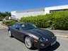 USED 2006 06 JAGUAR XKR 4.2 S Coupe 2dr Petrol Automatic (304 g/km, 400 bhp)-Rare Limited Edition XKR-S-Fantastic Low Mileage Example-2 Former Keepers-Last Keeper Since Aug 2011-Last Of The X100-White Badge-Finished In Copper Black Metallic-Heated Ivory Leather Upholstery-Recaro Sports Seats-Climate Control-20 Inch Split Rim Alloy Wheels-18 Services On File-Supplied New By Stratstone Jaguar Slough-Beautiful Example.The final run-out model was the S, which was available in four new colours in addition to the ones already on offer: Copper Black Metallic, Frost Blue Metallic, Bay Blue Metallic and Satin Silver Metallic. A revised white Jaguar Growler badge on the bonnet now featured chequered accents on either side. 
