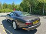 USED 2006 06 JAGUAR XKR 4.2 S Coupe 2dr Petrol Automatic (304 g/km, 400 bhp)-Rare Limited Edition XKR-S-Fantastic Low Mileage Example-2 Former Keepers-Last Keeper Since Aug 2011-Last Of The X100-White Badge-Finished In Copper Black Metallic-Heated Ivory Leather Upholstery-Recaro Sports Seats-Climate Control-20 Inch Split Rim Alloy Wheels-18 Services On File-Supplied New By Stratstone Jaguar Slough-Beautiful Example.The final run-out model was the S, which was available in four new colours in addition to the ones already on offer: Copper Black Metallic, Frost Blue Metallic, Bay Blue Metallic and Satin Silver Metallic. A revised white Jaguar Growler badge on the bonnet now featured chequered accents on either side. 