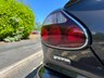 USED 2006 06 JAGUAR XKR 4.2 S Coupe 2dr Petrol Automatic (304 g/km, 400 bhp)-Rare Limited Edition XKR-S-Fantastic Low Mileage Example-2 Former Keepers-Last Keeper Since Aug 2011-Last Of The X100-White Badge-Finished In Copper Black Metallic-Heated Ivory Leather Upholstery-Recaro Sports Seats-Climate Control-20 Inch Split Rim Alloy Wheels-18 Services On File-Supplied New By Stratstone Jaguar Slough-Beautiful Example.The final run-out model was the S, which was available in four new colours in addition to the ones already on offer: Copper Black Metallic, Frost Blue Metallic, Bay Blue Metallic and Satin Silver Metallic. A revised white Jaguar Growler badge on the bonnet now featured chequered accents on either side. 
