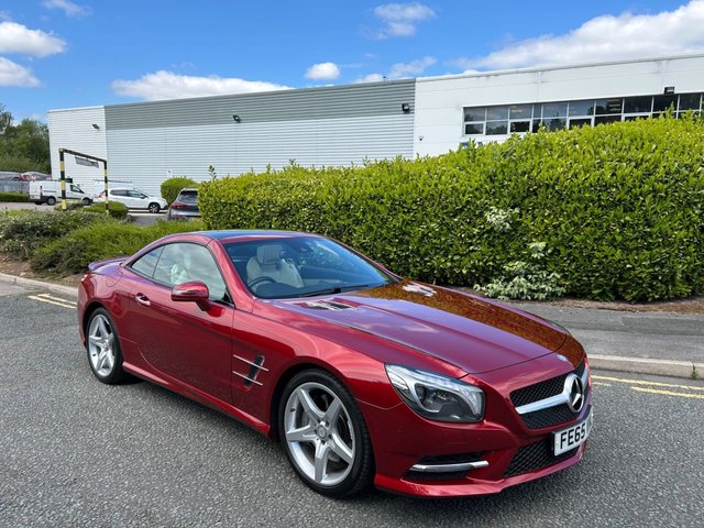 2015 65 Mercedes-Benz Sl 4.7 SL500 V8 AMG Sport Convertible 2dr Petrol G-Tronic+ Euro 6 (s/s) (455 ps)-Factory Extras Worth £3,025-STUNNING LOW MILEAGE EXAMPLE-FINISHED IN HYACINTH RED METALLIC WITH IVORY NAPPA LEATHER UPHOLSTERY-1 FORMER KEEPER-REVERSE CAMERA-ACTIVE PARK ASSIST-SPORTS STEERING WHEEL-AIR SCARF-HEATED SEATS-ROOF AMBIENT LIGHTING FUNCTION-ELECTRIC FOLDING MIRRORS-BLUETOOTH-CRUISE CONTROL-SATNAV-DAB RADIO-SPORTS SUSPENSION-AUTOMATIC HIGH BEAM CONTROL-19