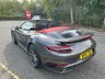 USED 2018 18 PORSCHE 911 3.8T 991 Turbo Convertible 2dr Petrol PDK 4WD Euro 6 (s/s) (540 ps)-2 Owner Car From New-Finished In Agate Grey Metallic-Heated Red Leather Upholstery-Heated Multifunction Steering Wheel-Porsche Dynamic Light System Plus-Rear Lid Air Intake Grilles Painted-Tinted Taillights-Interior & Exterior Package Painted-Leather Interior Package-Climate Control-Dab Radio-Bluetooth-Satnav-Ready To Be Enjoyed. 