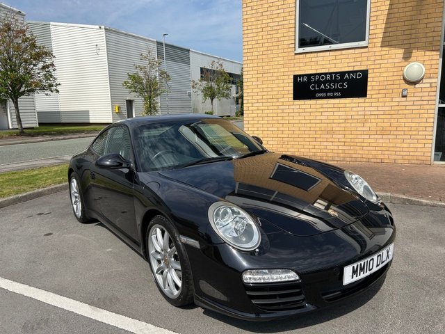 2010 10 Porsche 911 3.6 997 Carrera Coupe 2dr Petrol PDK (230 g/km, 345 bhp)-3 Former Keepers-Last Keeper Since Feb 2019-Finished In Basalt Black Metallic-Heated Black Leather Upholstery-Porsche Active Suspension Management-Rear Park Assist-Sport Chrono Package Plus-Bluetooth-Voice Control-Satnav-Climate Control-Pdk 3 Spoke Sports Steering Wheel With Paddle Shift-Universal Audio Interface-Sports Tailpipes-19 Inch Carrera Sport Alloy Wheels-7 Services On File-5 Official Porsche Centre.Fantastic Example Ready To Be Enjoyed.