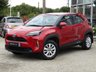 USED 2022 72 TOYOTA YARIS CROSS 1.5 VVT-h Icon SUV 5dr Petrol Hybrid E-CVT Euro 6 (s/s) (116 ps) Finished in SCARLET FLARE RED with Contrasting Dark Trim. This Yaris is a compact, self-charging hybrid SUV designed for all environments. It seamlessly blends electric and petrol power for efficiency, with no need to plug it in. Features include Low Mileage, Apple Play Nav, Rear View Camera, DAB Radio, Alloys, B/Tooth, Cruise Control and Balance of Toyota 5 Year Warranty (8 Years on EV Battery). Toyota Dealer serviced at 3421 miles and at 7010 miles.