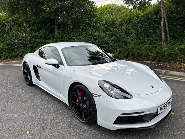 2019 69 Porsche 718 Cayman 2.5T GTS GPF Coupe 2dr Petrol PDK Euro 6 (s/s) (365 ps)-Factory Extras Worth &pound;5,759-2 Former Keepers-Last Keeper Since March 2022-Finished In Carrara White-Gts Interior Package-PASM Sports Suspension-Heated Seats-Cruise Control-Light Design Package-Park Assist Front & Rear-Bose Surround Sound System-Rear Wing & Door Handles Painted In High Gloss Black-Climate Control-Dab Radio-Bluetooth-Satnav-Instrument Dials In Carmine Red-Great Looking Example-The One To Have.