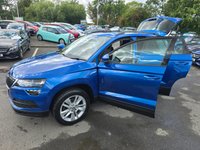 USED 2020 20 SKODA KAROQ 1.0 TSI SE SUV, 42,100 miles, 3 owners, service history, Euro 6 ULEZ, 6-Speed, Air Conditioning, Bluetooth, DAB, Rear Sensors and much much more! This 2020 Skoda Karoq TSI SE offers excellent value with its MOT valid until July 2026, providing peace of mind for the coming years.  This Euro 6 compliant model is powered by an efficient 1.0 litre petrol engine, making it a sensible choice for everyday driving.  Inside, you'll find a comfortable and practical cabin equipped with a DAB digital radio and Bluetooth connectivity for your entertainment and communication needs.  Convenience is further enhanced by the light and rain sensor system, w