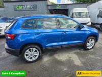 USED 2020 20 SKODA KAROQ 1.0 TSI SE SUV, 42,100 miles, 3 owners, service history, Euro 6 ULEZ, 6-Speed, Air Conditioning, Bluetooth, DAB, Rear Sensors and much much more! This 2020 Skoda Karoq TSI SE offers excellent value with its MOT valid until July 2026, providing peace of mind for the coming years.  This Euro 6 compliant model is powered by an efficient 1.0 litre petrol engine, making it a sensible choice for everyday driving.  Inside, you'll find a comfortable and practical cabin equipped with a DAB digital radio and Bluetooth connectivity for your entertainment and communication needs.  Convenience is further enhanced by the light and rain sensor system, w