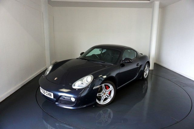 2009 59 Porsche Cayman 3.4 987 S Coupe 2dr Petrol Manual (223 g/km, 320 bhp) Factory Extras Worth £3,972-Lovely Example Finished In Atlas Grey Metallic-Heated Black Leather Upholstery-Rear Wiper-Windscreen With Grey Top Tint-Climate Control-Rear Park Assist-Sport Chrono Package-Bose Surround Sound System-Bi Xenon Headlights-Nice Example With Top Specification.