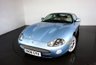USED 2006 06 JAGUAR XKR 4.2 S XKR Coupe White Badge 2dr Petrol Automatic (304 g/km, 400 bhp)-This example is one of the very, very last. A 2006 model registered just before the new X150 XK appeared. It has been cossetted from new and used rarely, having amassed a mileage of just over 14000 miles in total. It is as close as you will find to a new one-Launched in 1996, the model was revised in 2002 with the original 4.0-litre V8 increased in size to 4.2-litres and the power upped from 370bhp to 400bhp-Finished in Frost Blue Metallic with Heated magnolia leather sports seats.20-inch BBS split-rim alloys-This is the full-fat real deal, a genuine XKR, with the later and more powerful supercharged 4.2-litre V8 kicking out 400bhp. It runs sweetly and sounds incredible, the sharp whistle of the supercharger accompanying the eager rush of acceleration between each gear. It really is a fast and responsive car, yet despite the incredible performance on offer it still retains Jaguars traditionally cossetting ride 