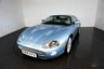 USED 2006 06 JAGUAR XKR 4.2 S XKR Coupe White Badge 2dr Petrol Automatic (304 g/km, 400 bhp)-This example is one of the very, very last. A 2006 model registered just before the new X150 XK appeared. It has been cossetted from new and used rarely, having amassed a mileage of just over 14000 miles in total. It is as close as you will find to a new one-Launched in 1996, the model was revised in 2002 with the original 4.0-litre V8 increased in size to 4.2-litres and the power upped from 370bhp to 400bhp-Finished in Frost Blue Metallic with Heated magnolia leather sports seats.20-inch BBS split-rim alloys-This is the full-fat real deal, a genuine XKR, with the later and more powerful supercharged 4.2-litre V8 kicking out 400bhp. It runs sweetly and sounds incredible, the sharp whistle of the supercharger accompanying the eager rush of acceleration between each gear. It really is a fast and responsive car, yet despite the incredible performance on offer it still retains Jaguars traditionally cossetting ride 