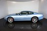 USED 2006 06 JAGUAR XKR 4.2 S XKR Coupe White Badge 2dr Petrol Automatic (304 g/km, 400 bhp)-This example is one of the very, very last. A 2006 model registered just before the new X150 XK appeared. It has been cossetted from new and used rarely, having amassed a mileage of just over 14000 miles in total. It is as close as you will find to a new one-Launched in 1996, the model was revised in 2002 with the original 4.0-litre V8 increased in size to 4.2-litres and the power upped from 370bhp to 400bhp-Finished in Frost Blue Metallic with Heated magnolia leather sports seats.20-inch BBS split-rim alloys-This is the full-fat real deal, a genuine XKR, with the later and more powerful supercharged 4.2-litre V8 kicking out 400bhp. It runs sweetly and sounds incredible, the sharp whistle of the supercharger accompanying the eager rush of acceleration between each gear. It really is a fast and responsive car, yet despite the incredible performance on offer it still retains Jaguars traditionally cossetting ride 