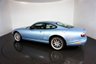 USED 2006 06 JAGUAR XKR 4.2 S XKR Coupe White Badge 2dr Petrol Automatic (304 g/km, 400 bhp)-This example is one of the very, very last. A 2006 model registered just before the new X150 XK appeared. It has been cossetted from new and used rarely, having amassed a mileage of just over 14000 miles in total. It is as close as you will find to a new one-Launched in 1996, the model was revised in 2002 with the original 4.0-litre V8 increased in size to 4.2-litres and the power upped from 370bhp to 400bhp-Finished in Frost Blue Metallic with Heated magnolia leather sports seats.20-inch BBS split-rim alloys-This is the full-fat real deal, a genuine XKR, with the later and more powerful supercharged 4.2-litre V8 kicking out 400bhp. It runs sweetly and sounds incredible, the sharp whistle of the supercharger accompanying the eager rush of acceleration between each gear. It really is a fast and responsive car, yet despite the incredible performance on offer it still retains Jaguars traditionally cossetting ride 