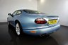 USED 2006 06 JAGUAR XKR 4.2 S XKR Coupe White Badge 2dr Petrol Automatic (304 g/km, 400 bhp)-This example is one of the very, very last. A 2006 model registered just before the new X150 XK appeared. It has been cossetted from new and used rarely, having amassed a mileage of just over 14000 miles in total. It is as close as you will find to a new one-Launched in 1996, the model was revised in 2002 with the original 4.0-litre V8 increased in size to 4.2-litres and the power upped from 370bhp to 400bhp-Finished in Frost Blue Metallic with Heated magnolia leather sports seats.20-inch BBS split-rim alloys-This is the full-fat real deal, a genuine XKR, with the later and more powerful supercharged 4.2-litre V8 kicking out 400bhp. It runs sweetly and sounds incredible, the sharp whistle of the supercharger accompanying the eager rush of acceleration between each gear. It really is a fast and responsive car, yet despite the incredible performance on offer it still retains Jaguars traditionally cossetting ride 