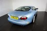 USED 2006 06 JAGUAR XKR 4.2 S XKR Coupe White Badge 2dr Petrol Automatic (304 g/km, 400 bhp)-This example is one of the very, very last. A 2006 model registered just before the new X150 XK appeared. It has been cossetted from new and used rarely, having amassed a mileage of just over 14000 miles in total. It is as close as you will find to a new one-Launched in 1996, the model was revised in 2002 with the original 4.0-litre V8 increased in size to 4.2-litres and the power upped from 370bhp to 400bhp-Finished in Frost Blue Metallic with Heated magnolia leather sports seats.20-inch BBS split-rim alloys-This is the full-fat real deal, a genuine XKR, with the later and more powerful supercharged 4.2-litre V8 kicking out 400bhp. It runs sweetly and sounds incredible, the sharp whistle of the supercharger accompanying the eager rush of acceleration between each gear. It really is a fast and responsive car, yet despite the incredible performance on offer it still retains Jaguars traditionally cossetting ride 
