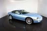 USED 2006 06 JAGUAR XKR 4.2 S XKR Coupe White Badge 2dr Petrol Automatic (304 g/km, 400 bhp)-This example is one of the very, very last. A 2006 model registered just before the new X150 XK appeared. It has been cossetted from new and used rarely, having amassed a mileage of just over 14000 miles in total. It is as close as you will find to a new one-Launched in 1996, the model was revised in 2002 with the original 4.0-litre V8 increased in size to 4.2-litres and the power upped from 370bhp to 400bhp-Finished in Frost Blue Metallic with Heated magnolia leather sports seats.20-inch BBS split-rim alloys-This is the full-fat real deal, a genuine XKR, with the later and more powerful supercharged 4.2-litre V8 kicking out 400bhp. It runs sweetly and sounds incredible, the sharp whistle of the supercharger accompanying the eager rush of acceleration between each gear. It really is a fast and responsive car, yet despite the incredible performance on offer it still retains Jaguars traditionally cossetting ride 