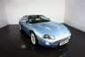 USED 2006 06 JAGUAR XKR 4.2 S XKR Coupe White Badge 2dr Petrol Automatic (304 g/km, 400 bhp)-This example is one of the very, very last. A 2006 model registered just before the new X150 XK appeared. It has been cossetted from new and used rarely, having amassed a mileage of just over 14000 miles in total. It is as close as you will find to a new one-Launched in 1996, the model was revised in 2002 with the original 4.0-litre V8 increased in size to 4.2-litres and the power upped from 370bhp to 400bhp-Finished in Frost Blue Metallic with Heated magnolia leather sports seats.20-inch BBS split-rim alloys-This is the full-fat real deal, a genuine XKR, with the later and more powerful supercharged 4.2-litre V8 kicking out 400bhp. It runs sweetly and sounds incredible, the sharp whistle of the supercharger accompanying the eager rush of acceleration between each gear. It really is a fast and responsive car, yet despite the incredible performance on offer it still retains Jaguars traditionally cossetting ride 