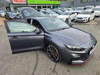 USED 2020 Y HYUNDAI I30 Grey 2.0 T-GDi N Performance Fastback, 39,900 miles, Euro 6 ULEZ, 6-Speed, A/C, Part Leather, Heated Seats, Sat Nav, Rear Camera, FSH, great spec. This 2020 Hyundai i30 T-GDi N Performance boasts a full service history at 6k, 16k, 26k, 33k, 38k, and with its last service completed on 2025-09-26 at 39,515 miles, offering peace of mind alongside its remaining 3 months warranty. This Euro 6 compliant model features a powerful 2.0L petrol engine and comes equipped with advanced LED headlamps, automatic headlights with a dusk sensor, and dual zone climate control for your comfort. Connectivity is seamless with Android Auto integration, and park