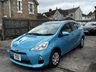 USED 2012 TOYOTA AQUA 1.5 Automatic Petrol Hybrid Hatchback Blue 5dr JAPANESE IMPORTED TOYOTA AQUA/ PRIUS CITY + LOW MILEAGE 1.5 HYBRID + CLEAN CONDITION THROUGHOUT + CHEAP/ ECO + LONG MOT/ FRESH SERVICE + FINISHED IN METALLIC LIGHT BLUE + SPEC INCLUDES WHITE AND BLACK CLOTH INTERIOR, ELECTRIC MIRRORS, FOLDING DOOR MIRRORS, PRIVACY GLASS, A/C, WHEEL TRIMS, REMOTE LOCKING + 3 MONTHS WARRANTY + 12 MONTHS AA BREAKDOWN COVER INCLUDED