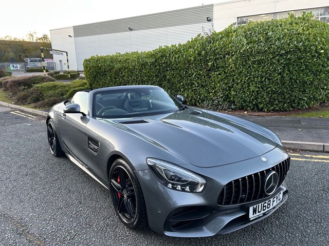 2018 68 Mercedes-Benz Amg GT 4.0 V8 BiTurbo GTC Roadster 2dr Petrol SpdS DCT Euro 6 (s/s) (557 ps)-Superb Example Finished In Selenite Grey Metallic-Heated Black Nappa Leather Upholstery-Rear Axle Steering-AMG Ride Control-Mercedes Benz Connect-Rear View Camera-Rear Parking Assist-Track Pace-Memory Package-Drivers Seat, Steering Column & Mirrors-Airscarf-7 Speed Automatic-Electronic Locking Differential-Adjustable Chassis-Electric Folding Exterior Mirrors-Dab-Bluetooth-Satnav-Mfsw-Dual Climate Control-Cruise Control-Collision Warning System With Active Brake Function-Automatic High Beam Control-Static Led Headlights-Premium Sound System-Keyless Go-Mirror Package-Front Memory Package-Switchable Exhaust System-Full Mercedes Service History.Great Value.The AMG GT C Model Was Manufactured For Five Years, From 2017 to 2021.