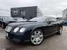 USED 2005 05 BENTLEY CONTINENTAL 6.0 GT Coupe 2dr Petrol Automatic (410 g/km, 552 bhp)-Superb Continental Gt-Finished In Dark Sapphire Metallic-Supplied New By Hr Owen Cheltenham-Main Hide In Magnolia-Secondary Hide In Nautic-Seat Belts & Carpets To Match Secondary Hide-Emblem Stitching-Automatic Headlight Range Adjustment-Climate Control-Cruise Control-Mfsw-Satnav-Dark Stained Burr Walnut-Individual Armrests For Both Front Seats-Heated Front Seats-Diamond Quilted Leather-Keyless Entry-Cd Changer-14 Way Memory Front Electric Seats-Lumbar Support-Rear Fog Lights-Bluetooth-Mulliner Driving Specification-Unmarked 20 Inch Two Piece Alloy Wheels With Matching Pirelli Tyres-16 Services On File. 