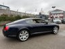 USED 2005 05 BENTLEY CONTINENTAL 6.0 GT Coupe 2dr Petrol Automatic (410 g/km, 552 bhp)-Superb Continental Gt-Finished In Dark Sapphire Metallic-Supplied New By Hr Owen Cheltenham-Main Hide In Magnolia-Secondary Hide In Nautic-Seat Belts & Carpets To Match Secondary Hide-Emblem Stitching-Automatic Headlight Range Adjustment-Climate Control-Cruise Control-Mfsw-Satnav-Dark Stained Burr Walnut-Individual Armrests For Both Front Seats-Heated Front Seats-Diamond Quilted Leather-Keyless Entry-Cd Changer-14 Way Memory Front Electric Seats-Lumbar Support-Rear Fog Lights-Bluetooth-Mulliner Driving Specification-Unmarked 20 Inch Two Piece Alloy Wheels With Matching Pirelli Tyres-16 Services On File. 