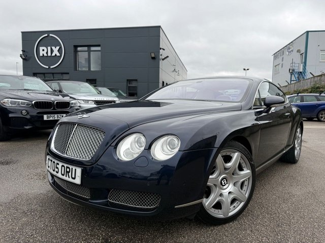 2005 05 Bentley Continental 6.0 GT Coupe 2dr Petrol Automatic (410 g/km, 552 bhp)-Superb Continental Gt-Finished In Dark Sapphire Metallic-Supplied New By Hr Owen Cheltenham-Main Hide In Magnolia-Secondary Hide In Nautic-Seat Belts & Carpets To Match Secondary Hide-Emblem Stitching-Automatic Headlight Range Adjustment-Climate Control-Cruise Control-Mfsw-Satnav-Dark Stained Burr Walnut-Individual Armrests For Both Front Seats-Heated Front Seats-Diamond Quilted Leather-Keyless Entry-Cd Changer-14 Way Memory Front Electric Seats-Lumbar Support-Rear Fog Lights-Bluetooth-Mulliner Driving Specification-Unmarked 20 Inch Two Piece Alloy Wheels With Matching Pirelli Tyres-16 Services On File.