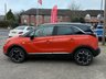 USED 2022 22 VAUXHALL CROSSLAND 1.2 Turbo Ultimate SUV 5dr Petrol Manual Euro 6 (s/s) (130 ps) Finished in  POWER ORANGE MET with DARK GREY PART ALCANTARA TRIM. The Crossland is a spacious, practical, and economical family car. It represents a good-value, well-equipped family car that's easy to drive and cheap to run. Features include,  17" Alloy Wheels, Cruise Control, DAB Radio, Rear Camera, Parking Sensors, Black Roof, and much more. Dealer serviced at 5748 miles, 8789 miles and on arrival at 11589 miles.