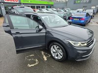 USED 2022 22 VOLKSWAGEN TIGUAN 1.4 TSI Life Plug-in Hybrid SUV Automatic in Grey with 63,500 miles, Euro 6, Adaptive cruise, Sat Nav, Front and Rear sensors and Reverse camera. This 2022 Volkswagen Tiguan TSI Life offers peace of mind with a 12 month MOT provided on purchase and a 3 month warranty.  This Euro 6 compliant, 1.4 litre petrol plug in hybrid is presented in the Life trim.  It comes equipped with a useful rear view camera that includes parking assistance, and for your comfort, it features 3 zone electronic climate control with independent rear air conditioning.  Long journeys are made easier with adaptive cruise control, and you can stay connected and entert