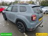 USED 2023 73 DACIA DUSTER 1.3 TCe Extreme SUV in Grey with 67,300 miles, Euro 6, Full main dealer history, 6 Speed Manual gearbox, Sat Nav, Heated Seats, Rear camera and more. This 2023 Dacia Duster TCe EXTREME is a standout example, boasting a full dealership service history and having had only one owner from new. This particular EXTREME trim model is equipped with a responsive 1.3L Petrol Engine, meeting Euro 6 emission standards. For your peace of mind, it comes with a 3 month warranty and a 12 month MOT provided on purchase. The vehicle has been meticulously maintained, with its last service recorded at 57,000 miles on 16th May 2026, ensuring its continued roadwor