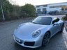 USED 2018 18 PORSCHE 911 3.0T 991 Carrera S Coupe 2dr Petrol PDK Euro 6 (s/s) (420 ps)-Factory Extras Worth �&pound;7,500.00-Superb Example-Finished In Rhodium Silver Metallic-Heated Black Leather Upholstery-Rev Counter Dial Face In Black-20 Inch Carrera Classic Alloy Wheels With Matching Pirelli P Zero Tyres-Heated Multifunction Steering Wheel-Front & Rear Park Assist-Electric Slide & Tilt Glass Sunroof-Electric Folding Exterior Door Mirrors-Isofix-Bose Surround Sound System-Sport Chrono Package-Factory Privacy Glass To Rear Side Windows & Rear Window-Porsche Crest On Headrests-Ready To Be Enjoyed For That European Road Trip... 