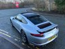 USED 2018 18 PORSCHE 911 3.0T 991 Carrera S Coupe 2dr Petrol PDK Euro 6 (s/s) (420 ps)-Factory Extras Worth �&pound;7,500.00-Superb Example-Finished In Rhodium Silver Metallic-Heated Black Leather Upholstery-Rev Counter Dial Face In Black-20 Inch Carrera Classic Alloy Wheels With Matching Pirelli P Zero Tyres-Heated Multifunction Steering Wheel-Front & Rear Park Assist-Electric Slide & Tilt Glass Sunroof-Electric Folding Exterior Door Mirrors-Isofix-Bose Surround Sound System-Sport Chrono Package-Factory Privacy Glass To Rear Side Windows & Rear Window-Porsche Crest On Headrests-Ready To Be Enjoyed For That European Road Trip... 