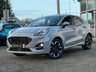 USED 2021 21 FORD PUMA 1.0T EcoBoost ST-Line X SUV 5dr Petrol DCT Euro 6 (s/s) (125 ps) Finished in GREY MATTER with BLACK PART LEATHER with Red Stitching Trim. This Ford Puma certainly looks the part. It's got the raised up driving position, the eye-catching design, and a sort of miniature SUV shape. Features include Sat Nav, DAB Radio, B/Tooth, Apple Play, Power Folding Mirrors, 18" Alloys, Park Sensors, Heated Front Screen, B and O Speakers, 2 Keys and more. Dealer serviced at 17898 miles and on arrival at 28226 miles.