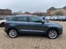 USED 2018 68 SKODA KAROQ 1.5 TSI SE L SUV 5dr Petrol Manual Euro 6 (s/s) (150 ps) ONE OWNER+8 INCH TOUCHSCREEN SATELLITE NAVIGATION SYSTEM+DAB DIGITAL RADIO+BLUETOOTH+DUAL ZONE CLIMATE CONTROL AIR-CONDITIONING+CRUISE CONTROL+ LUXURIOUS HEATED SEATS+AUTOMATIC HEADLIGHT ACTIVATION+RAIN-SENSING WINDSCREEN WIPERS+FRONT & REAR PARKING ASSISTANCE WITH PARKING CAMERA+'QUARTZ GREY' PAINT+18 INCH ALLOY WHEELS.