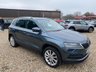 USED 2018 68 SKODA KAROQ 1.5 TSI SE L SUV 5dr Petrol Manual Euro 6 (s/s) (150 ps) ONE OWNER+8 INCH TOUCHSCREEN SATELLITE NAVIGATION SYSTEM+DAB DIGITAL RADIO+BLUETOOTH+DUAL ZONE CLIMATE CONTROL AIR-CONDITIONING+CRUISE CONTROL+ LUXURIOUS HEATED SEATS+AUTOMATIC HEADLIGHT ACTIVATION+RAIN-SENSING WINDSCREEN WIPERS+FRONT & REAR PARKING ASSISTANCE WITH PARKING CAMERA+'QUARTZ GREY' PAINT+18 INCH ALLOY WHEELS.