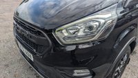 USED 2023 72 FORD TRANSIT CUSTOM Crewvan Double Cab Trail L2 H1 Tdci 130 PS LWB 320 With Air Conditioning, Full Electric Pack, Leather Seats, Alloy Whhels, Full Black Pack, Reverse Camera, Bulkhead, Ply Lining,Heated Screen. 1 Owner, 2 Keys, Service History @24,686 and will be serviced for you. In Great condition. Presenting a Ford Custom Crewvan Double Cab in the sought-after Trail specification. This L2 H1 long-wheelbase model offers the perfect balance of passenger comfort and commercial practicality, powered by a responsive 130 PS TDCi engine.  This one-owner vehicle comes with a comprehensive specification including air conditioning, a full electric pack, heated front screen, and a factory-fitted bulkhead. The interior features luxurious leather seats and a ply-lined load area for durability. Externally, it is enhanced by alloy wheels and the distinctive Full Black Pack. Manoeuvrability and safety are improved with the factory-fit reverse camera.  Offered with a full service history, having been recently serviced at 24,686 miles, and supplied with two keys. A complimentary full service will also be carried out prior to handover. This Crewvan is in excellent condition throughout, ready for its next owner. 