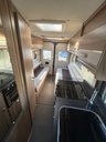 USED 2022 FIAT SWIFT SELECT 122 - 2 Berth lovely modern layout, end lounge area which can be used as two single beds (186cm (L) x 66cm (W) easily converts into double bed, galley kitchen including Dometic fridge, Thetford hob, oven, grill and sink. Wet room bathroom with stow away sink for extra space. Lots of storage space and captains swivel seats turn to create a cute little dining area. Fitted with Reversing camera, tow bar, external gas BBQ point, external shower. Yours for �&pound;55,995. Up to 7 years finance and warranty packages available. DIMENSIONS - LENGTH - 5.95M, WIDTH 2.26M, HEIGHT - 2.72M  