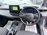 USED 2020 70 TOYOTA COROLLA Grey 2.0 VVT-h Design Touring Sports, 74,973 miles, ULEZ compliant, Hybrid auto, 8in Touchscreen, CarPlay/Android Auto, Sat Nav, Rear Camera, A/C. This 2020 Toyota Corolla VVT-h Design boasts an impressive service history with its last service completed on 30th October 2025 at 58,505 miles, offering peace of mind for its next owner. This Euro 6 compliant model features a powerful yet efficient 2.0L petrol hybrid engine, paired with the Design trim for a refined driving experience. You'll also benefit from a 3 month warranty and a 12 month MOT provided on purchase, ensuring roadworthiness.  Experience enhanced comfort and convenience with h