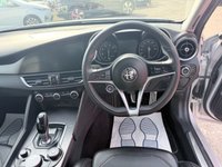 USED 2019 19 ALFA ROMEO GIULIA Grey 2.0T Veloce Euro 6 saloon, 75,150 miles, ULEZ compliant, Automatic, Leather, Sat nav, CarPlay/Android Auto, Climate, Cruise, DAB, 18in Alloys. This 2019 Alfa Romeo Giulia T Veloce offers a compelling blend of performance and technology, presented with a 3 month warranty for your peace of mind. As a Euro 6 compliant vehicle, it features a potent 2.0 litre petrol engine and is equipped with 18 inch dark finish alloy wheels, Bi-Xenon headlamps with LED daytime running lights, and the Convenience Pack which includes keyless entry. Inside, you will find the Alfa Connect 3D Nav 8.8 inch infotainment system, complete with Bluetooth connectivi